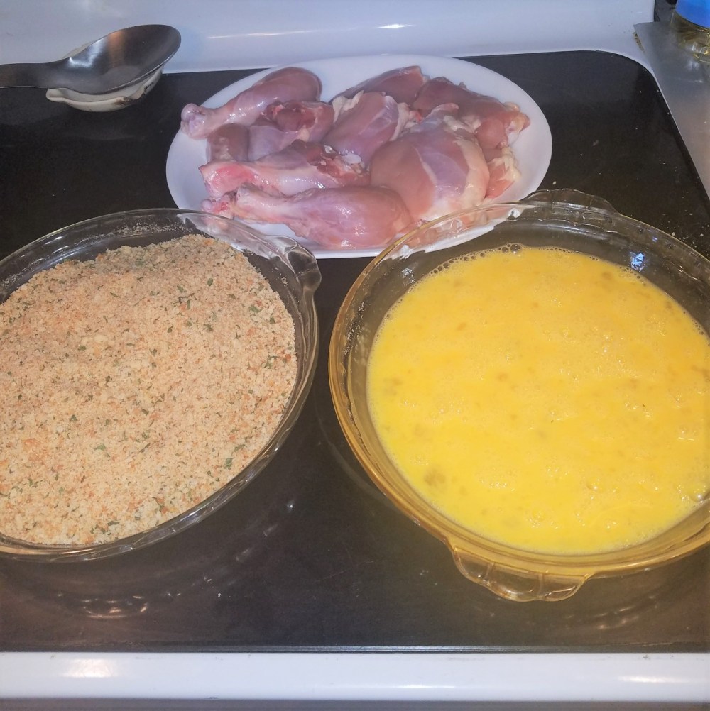 chicken, bread crumbs, eggs in bowls
